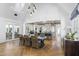 Spacious dining area with views of the gourmet kitchen, featuring high ceilings and modern lighting at 325 W Solano Dr, Phoenix, AZ 85013
