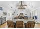 Formal dining room with a large table, seating for six, and an open view into the living room at 325 W Solano Dr, Phoenix, AZ 85013