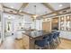 Gourmet kitchen with a large center island, wooden beams, and high-end stainless steel appliances at 325 W Solano Dr, Phoenix, AZ 85013
