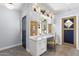 Bright office featuring a built-in desk, custom cabinets, and elegant herringbone flooring at 325 W Solano Dr, Phoenix, AZ 85013
