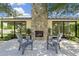 Close up of the outdoor fireplace with chairs and plants at 325 W Solano Dr, Phoenix, AZ 85013