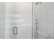 Bathroom shower with sleek glass door and updated fixtures at 325 W Solano Dr, Phoenix, AZ 85013