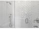 Beautiful bathroom shower featuring white tile and sleek fixtures at 325 W Solano Dr, Phoenix, AZ 85013