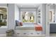 Charming window seat nook with built-in shelving and storage drawers at 325 W Solano Dr, Phoenix, AZ 85013