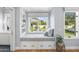 Cozy window seat with cushions and storage overlooking the backyard at 325 W Solano Dr, Phoenix, AZ 85013