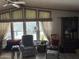 Bright living room with multiple windows, comfortable seating area and laminate floors at 3330 E Main St # 430, Mesa, AZ 85213