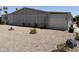 A wide view of the side yard shows the beautiful desert landscape featuring gravel and small plants at 3330 E Main St # 430, Mesa, AZ 85213