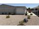 A wide view of the side yard shows the beautiful desert landscape featuring gravel and small plants at 3330 E Main St # 430, Mesa, AZ 85213