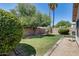 Well-maintained backyard featuring a lawn, mature trees, and block wall for privacy at 363 W Bruce Ave, Gilbert, AZ 85233