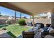 Backyard featuring a well-manicured lawn, grill, and patio furniture under a covered patio at 363 W Bruce Ave, Gilbert, AZ 85233