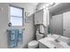This bathroom features a vanity, a toilet and a window that allows natural light into the space at 363 W Bruce Ave, Gilbert, AZ 85233