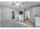 Bedroom with large window, dresser, flatscreen TV, and neutral decor for a calming atmosphere at 363 W Bruce Ave, Gilbert, AZ 85233
