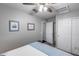 This bedroom features a ceiling fan, neutral-colored walls, and access to a closet at 363 W Bruce Ave, Gilbert, AZ 85233