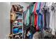 Walk-in closet with shelving, rods, clothing and bags for optimal storage at 363 W Bruce Ave, Gilbert, AZ 85233