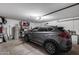 Garage featuring a modern SUV, storage shelves, and a water heater at 363 W Bruce Ave, Gilbert, AZ 85233