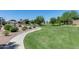 A community park offers a walking path, playground, open lawn and beautiful landscaping at 363 W Bruce Ave, Gilbert, AZ 85233