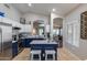 The charming kitchen boasts white and navy cabinets, stainless appliances, and an open design at 363 W Bruce Ave, Gilbert, AZ 85233