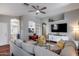 Open living room area features hardwood floors, recessed lights, a ceiling fan, and comfortable seating at 363 W Bruce Ave, Gilbert, AZ 85233