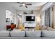 Open concept living room has hardwood floors, recessed lighting, a ceiling fan, and comfortable seating at 363 W Bruce Ave, Gilbert, AZ 85233