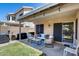 Covered patio with seating area, grill, and access to the home's interior at 363 W Bruce Ave, Gilbert, AZ 85233