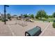 A community playground with swings and slides is near the beautiful grassy green lawn and lush landscaping at 363 W Bruce Ave, Gilbert, AZ 85233