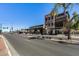 Street view featuring businesses with unique architecture and storefronts on a sunny day at 363 W Bruce Ave, Gilbert, AZ 85233