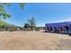View of an open lot with a mural on one side and cars in the background at 363 W Bruce Ave, Gilbert, AZ 85233