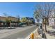 Daytime street view showcasing local businesses, trees, and sunny clear skies above at 363 W Bruce Ave, Gilbert, AZ 85233