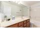 Bathroom featuring a large mirror, a tub-shower combination, a vanity, and neutral finishes at 3646 E Rousay Dr, San Tan Valley, AZ 85140