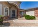 Inviting front entrance with brick columns, arched entryway, security door and well-maintained landscaping at 3646 E Rousay Dr, San Tan Valley, AZ 85140