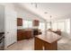 Bright kitchen with a big kitchen island and a dining room in the background at 3646 E Rousay Dr, San Tan Valley, AZ 85140