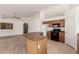 Open kitchen area with an island, connecting seamlessly to the adjacent living space at 3646 E Rousay Dr, San Tan Valley, AZ 85140