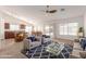Bright, open-concept living area flows into the kitchen with bar seating and a dining area, perfect for modern living at 3646 E Rousay Dr, San Tan Valley, AZ 85140