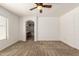 This main bedroom connects to the ensuite main bathroom with an arched doorway at 3646 E Rousay Dr, San Tan Valley, AZ 85140