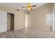 Bedroom featuring wood-look flooring, a closet, and a ceiling fan at 3651 W Escuda Dr, Glendale, AZ 85308