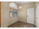 Dining area with a large window offering natural light and tile flooring at 3651 W Escuda Dr, Glendale, AZ 85308