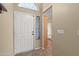 Entryway featuring a white front door with an arched window above and tile flooring at 3651 W Escuda Dr, Glendale, AZ 85308
