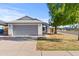 Charming single-story home with a well-manicured lawn and an attached two-car garage at 3651 W Escuda Dr, Glendale, AZ 85308
