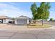 Charming single-story home with a well-manicured lawn and an attached two-car garage at 3651 W Escuda Dr, Glendale, AZ 85308