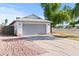 Charming single-story home with a well-manicured lawn and an attached two-car garage at 3651 W Escuda Dr, Glendale, AZ 85308