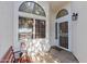 Inviting front porch area with bench seating and a security screen door at 3651 W Escuda Dr, Glendale, AZ 85308