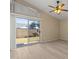 Bright living room with sliding glass door, wood-look flooring, and a view of the backyard at 3651 W Escuda Dr, Glendale, AZ 85308