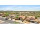 An aerial view of a neighborhood showcasing single-Gathering homes with desert landscaping and mountain views at 4131 E Cascalote Dr, Cave Creek, AZ 85331