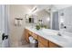 Bright bathroom with a long vanity, double sinks, and a shower-tub combo at 4131 E Cascalote Dr, Cave Creek, AZ 85331