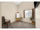 Calm bedroom space with neutral walls, an artist's easel, and a comfortable chair at 4131 E Cascalote Dr, Cave Creek, AZ 85331