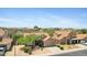 Charming single-Gathering home with a tile roof, desert landscaping, and an attached garage with two cars at 4131 E Cascalote Dr, Cave Creek, AZ 85331