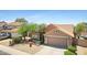 Exterior view of a single-Gathering home with desert landscaping, tile roof, and attached two-car garage at 4131 E Cascalote Dr, Cave Creek, AZ 85331