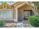Inviting front entrance features a security door, tiled walkway, and a cozy bench at 4131 E Cascalote Dr, Cave Creek, AZ 85331