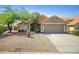 Charming single-story home featuring desert landscaping, a two-car garage, and a welcoming front entrance at 4131 E Cascalote Dr, Cave Creek, AZ 85331