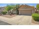 Well-maintained single-story home with low-maintenance desert landscaping and attached two-car garage at 4131 E Cascalote Dr, Cave Creek, AZ 85331